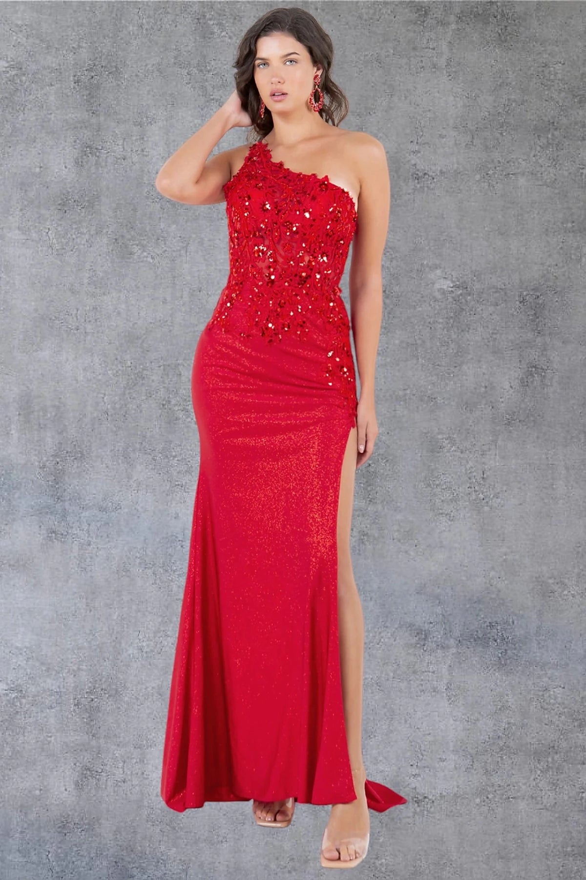 Detailed view highlights red prom dress showcasing fitted silhouette in sparkling fabric.