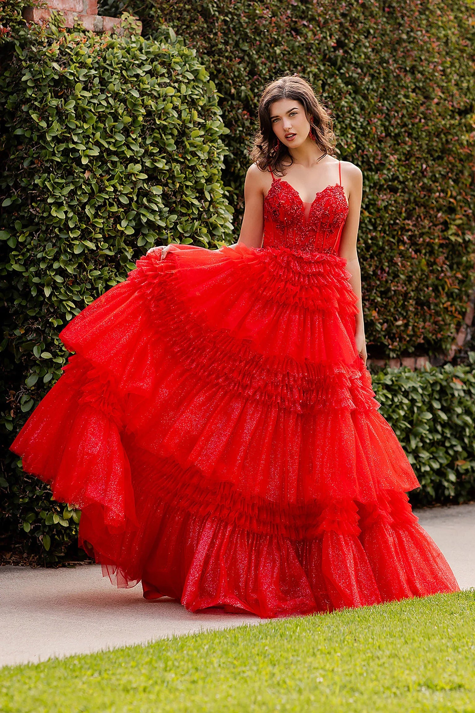 Red prom dress showcasing tiered skirt with gathered ruffled layers