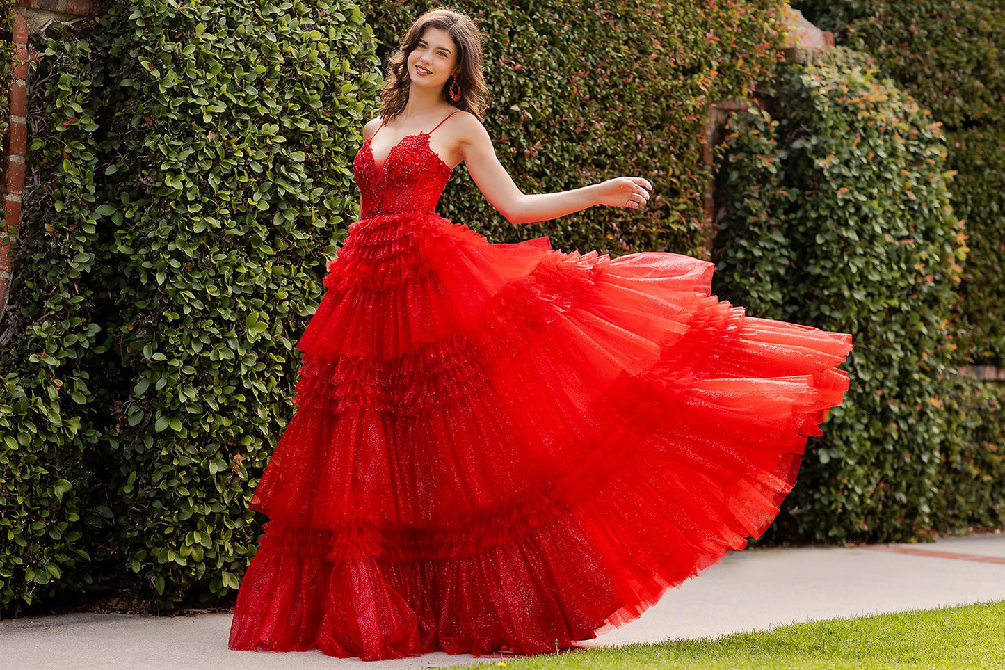 Red prom dress completed with voluminous silhouette and floor-length design