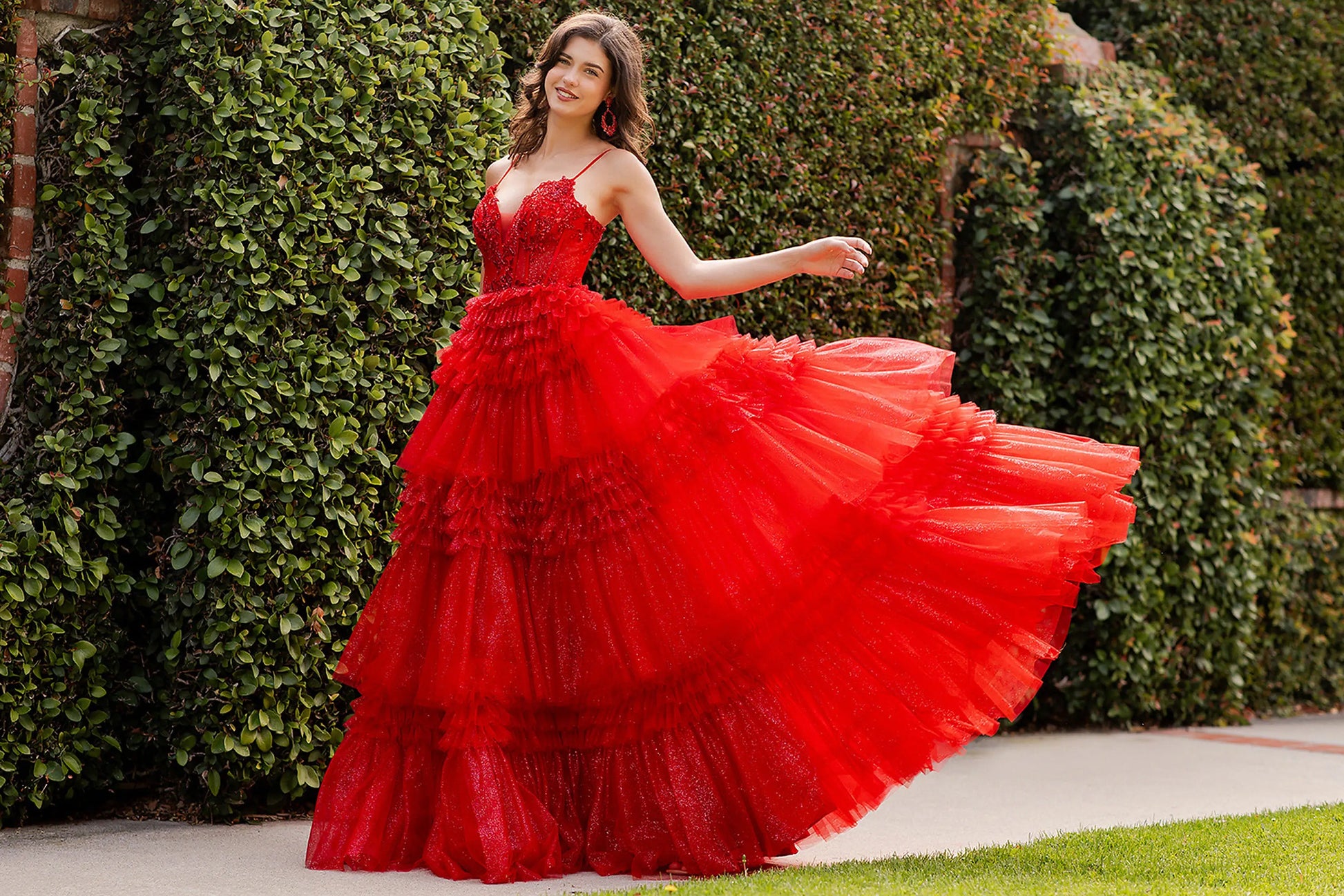 Red prom dress completed with voluminous silhouette and floor-length design