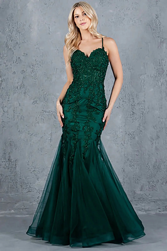 A full-length view of a woman wearing green mermaid dress with lace-up corset closure.