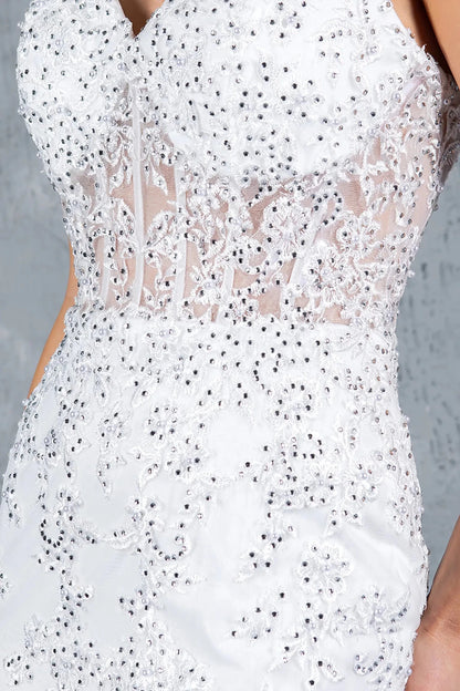 A close-up view of a woman wearing a silver lace corset bodice with beadwork and embroidery.