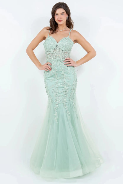 A full-length view of a woman wearing sage mermaid dress with lace-up corset closure.