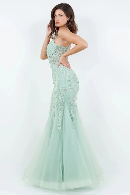 A side profile view of a woman wearing a sage mermaid prom dress, highlighting the sculpted silhouette and dramatic flare.