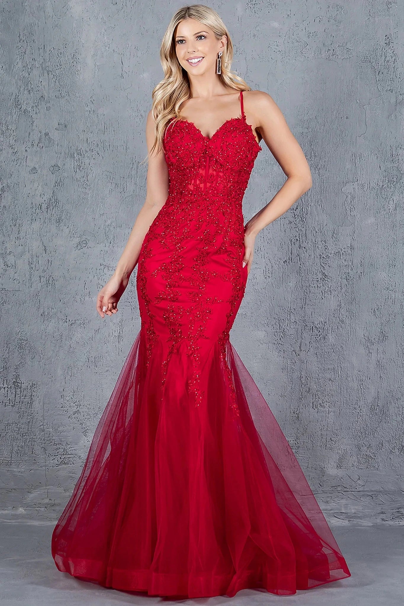 Burgundy mermaid gown with fitted bodice and lace embroidery