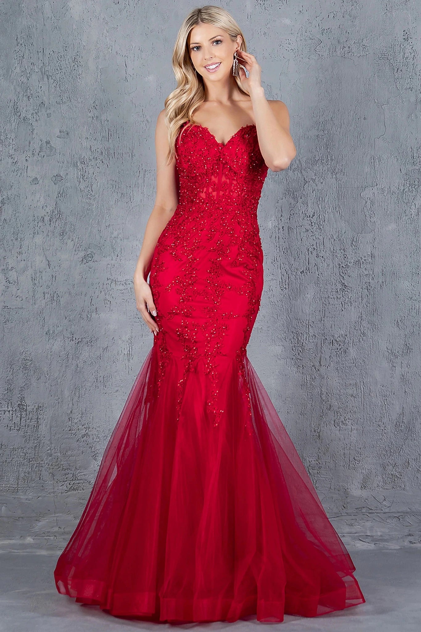 Burgundy mermaid gown styled with sweetheart neckline and spaghetti straps