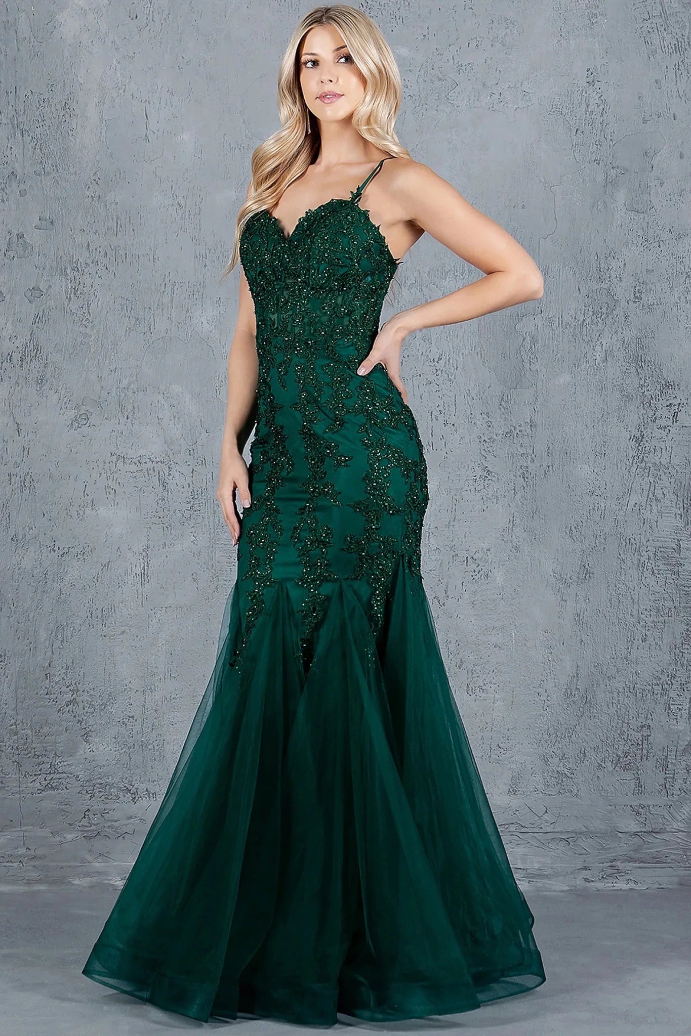 Hunter Green mermaid gown showcasing tulle overlay flaring from hips into mermaid silhouette