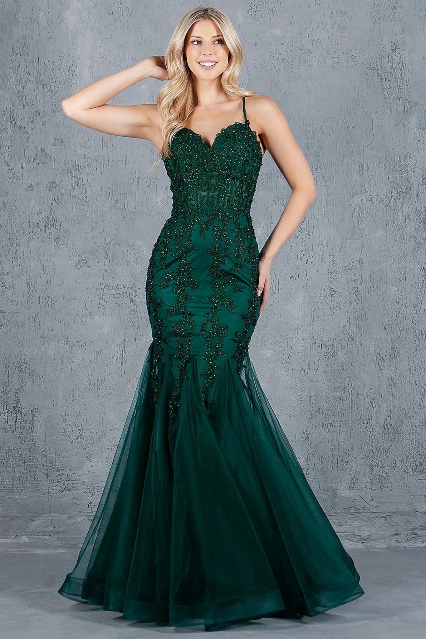 Hunter Green mermaid gown styled with sweetheart neckline and spaghetti straps