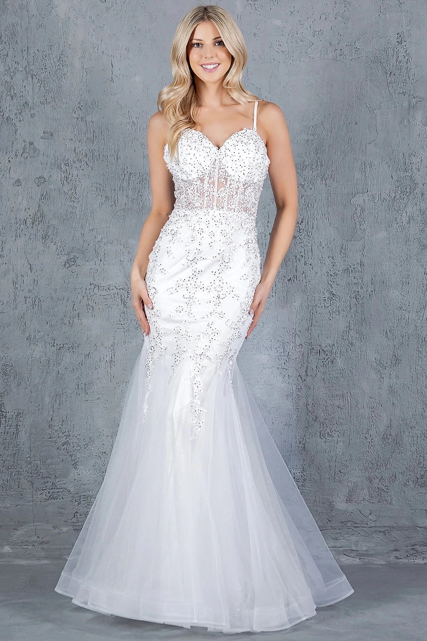 Off White mermaid gown styled with sweetheart neckline and spaghetti straps