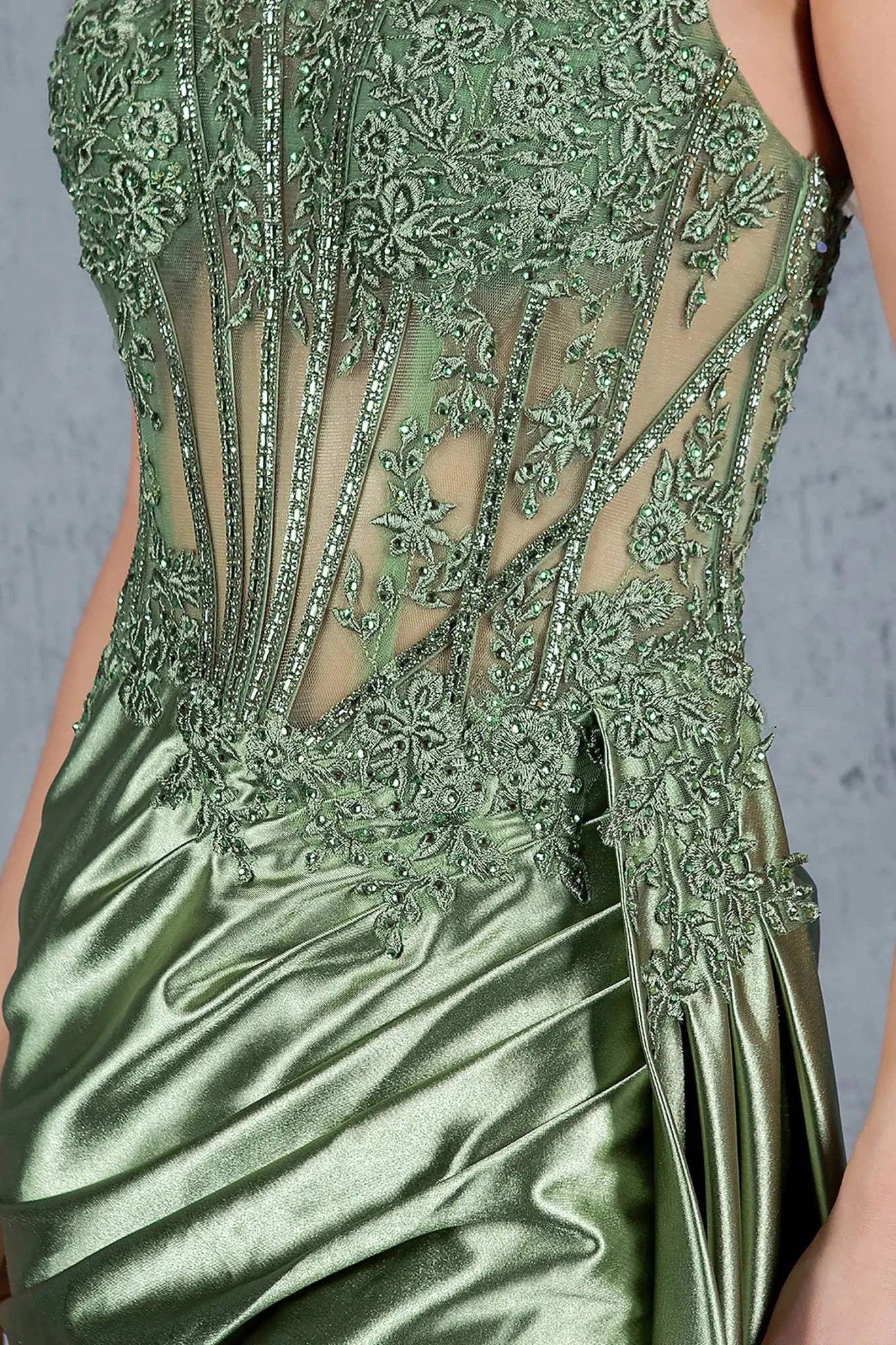 Sage prom dress featuring beads and sequins across bodice and skirt
