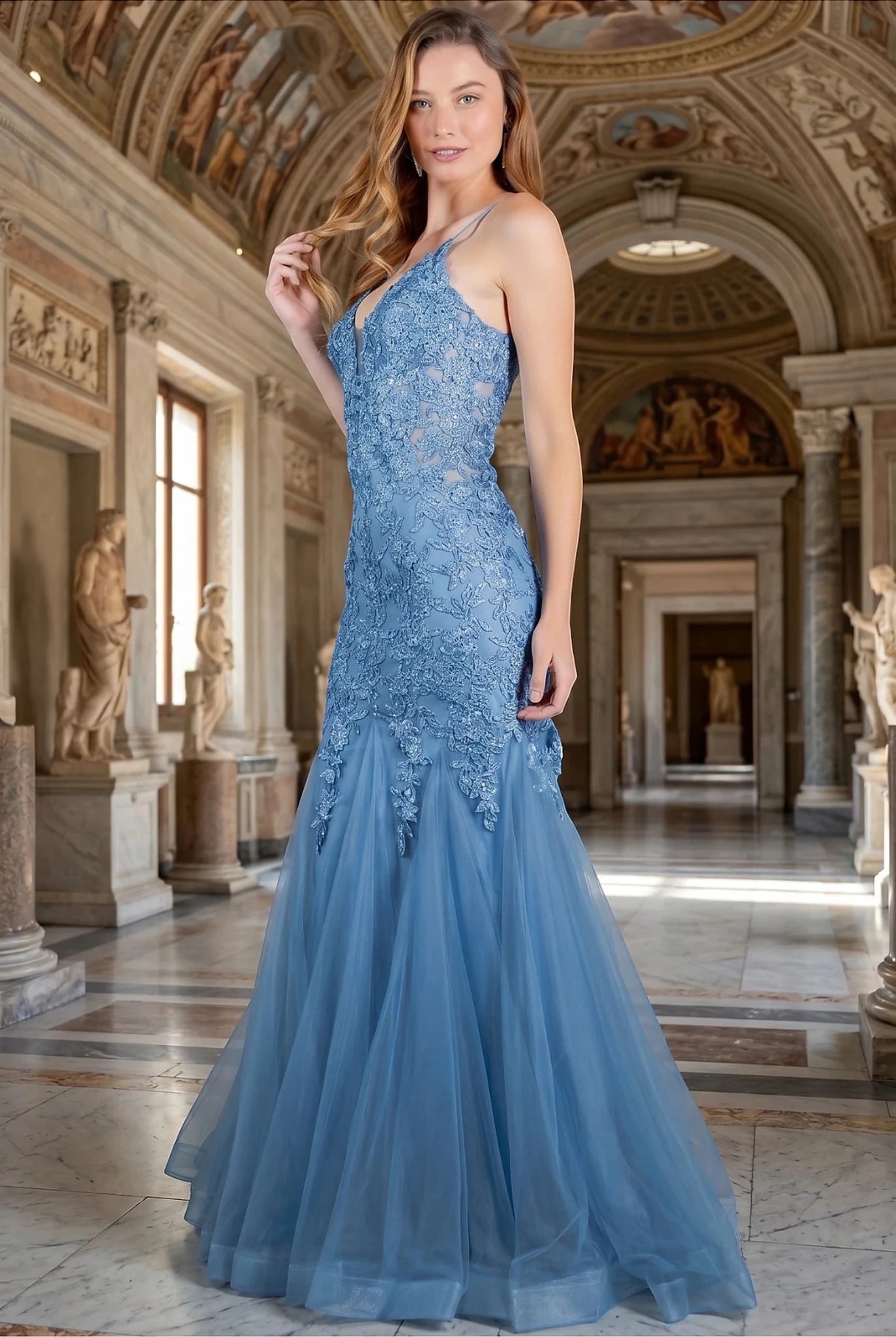 Dusty Blue prom dress completed with embroidery extending down skirt