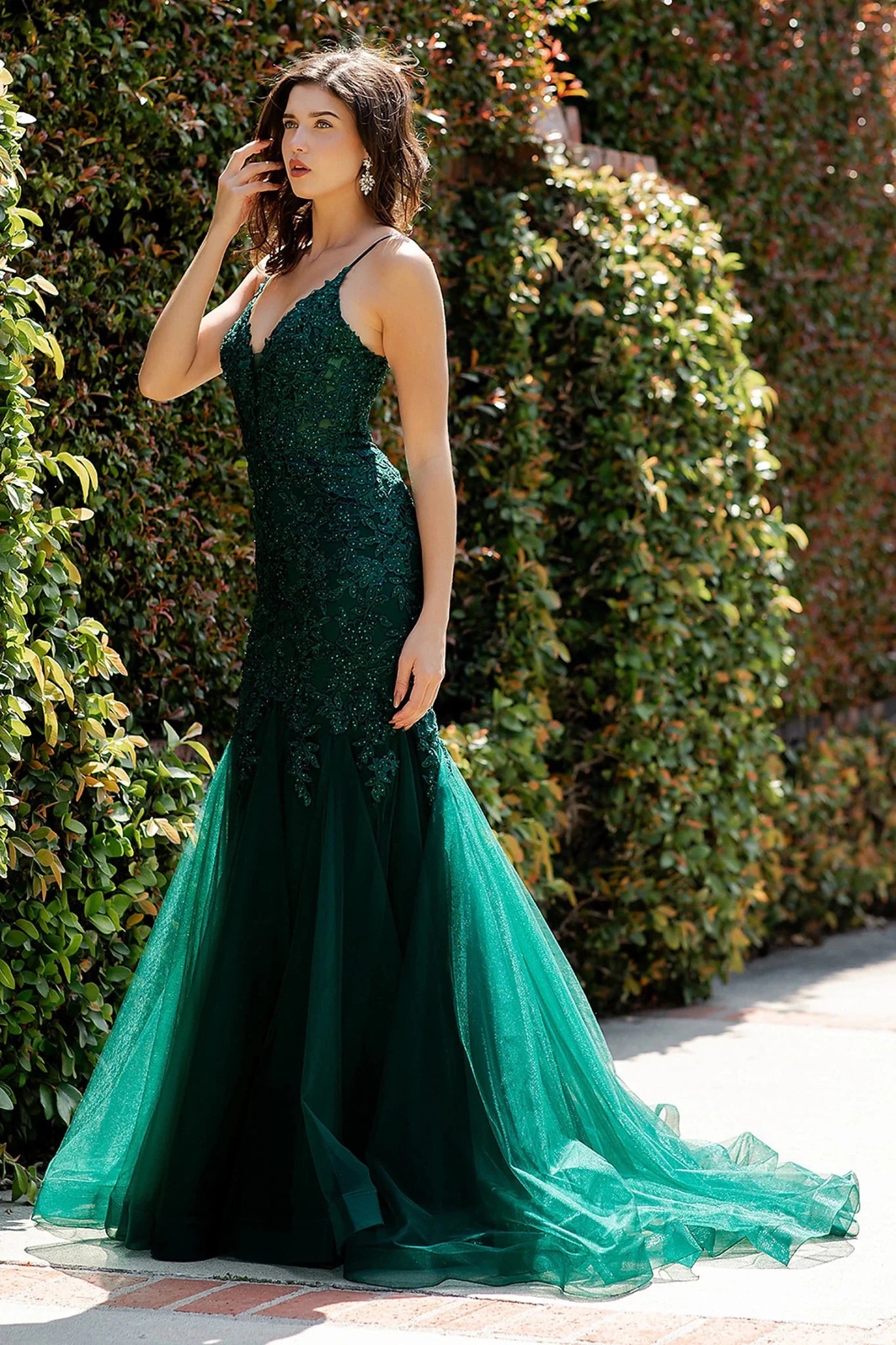 Hunter green prom dress completed with embroidery extending down skirt