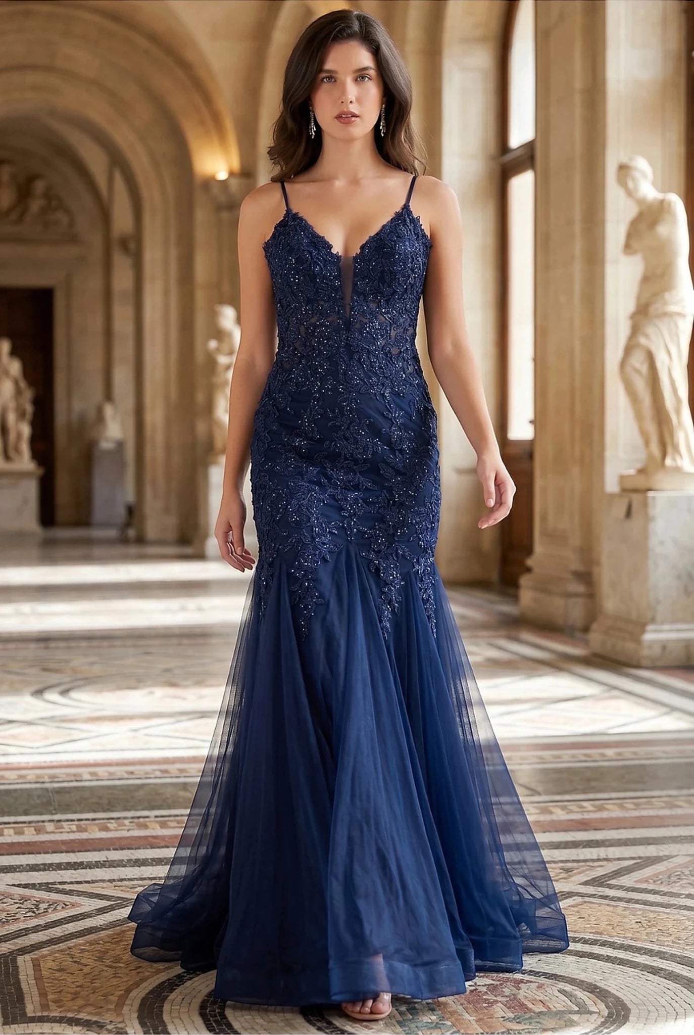 Navy prom dress with plunging V-neckline and spaghetti straps