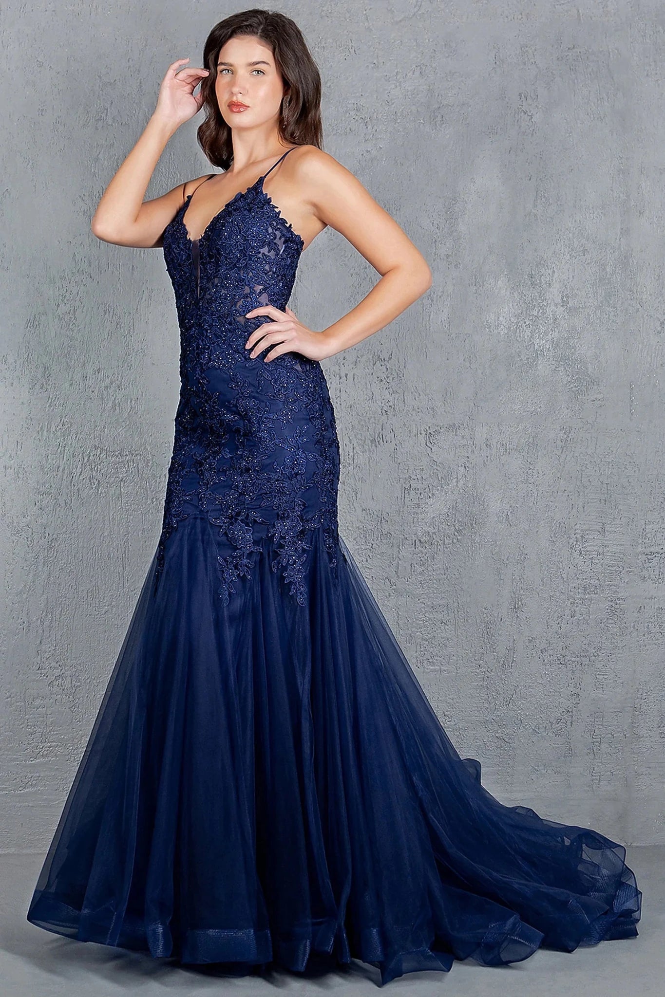 Navy prom dress completed with embroidery extending down skirt