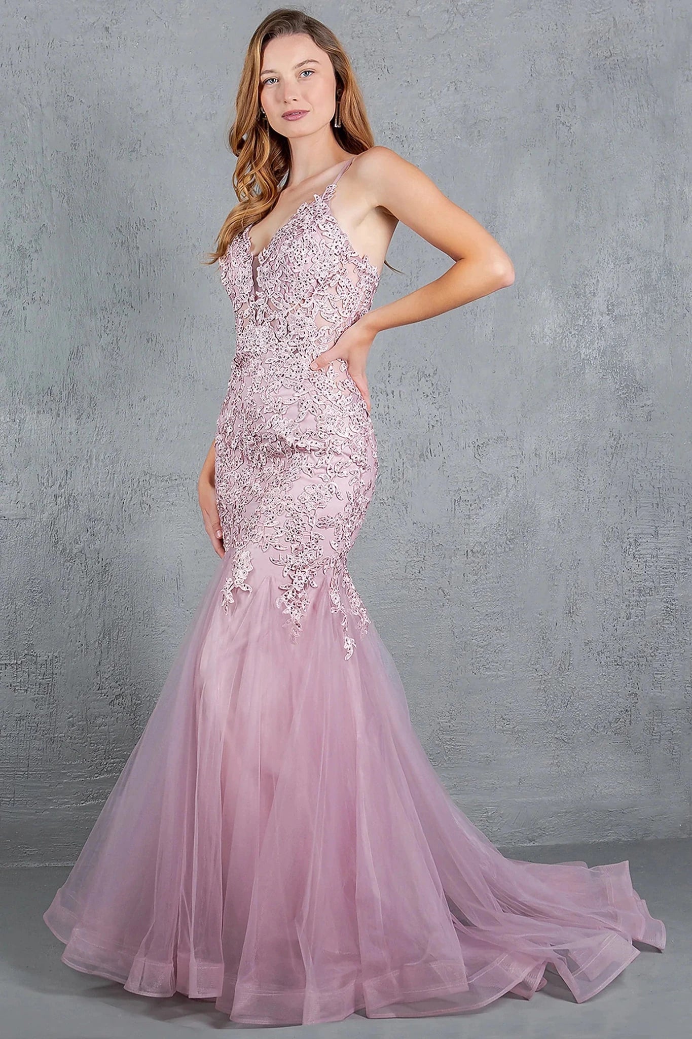 Rose gold prom dress completed with embroidery extending down skirt