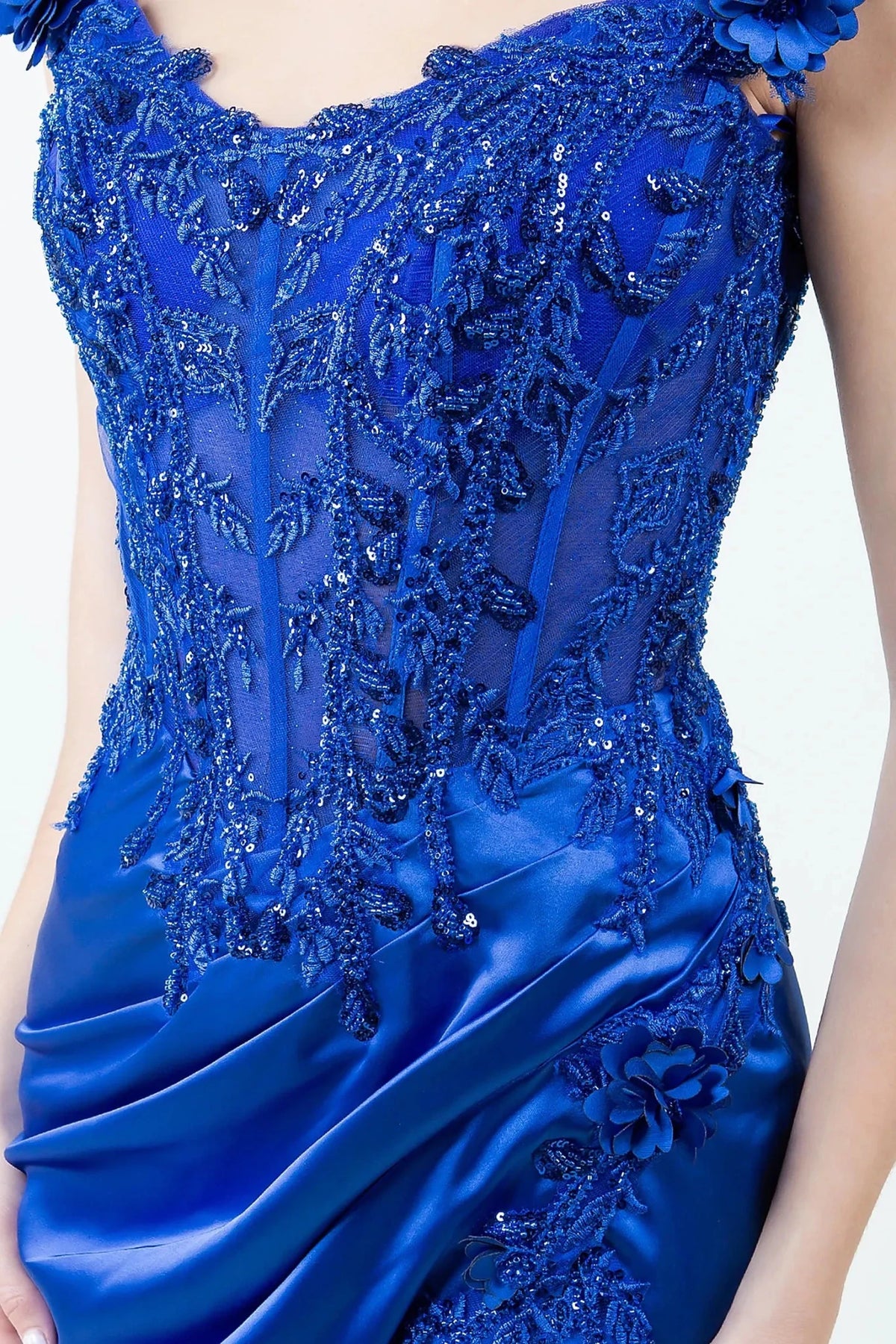 Detailed view highlights royal blue evening dress featuring floral embroidery lace appliques.