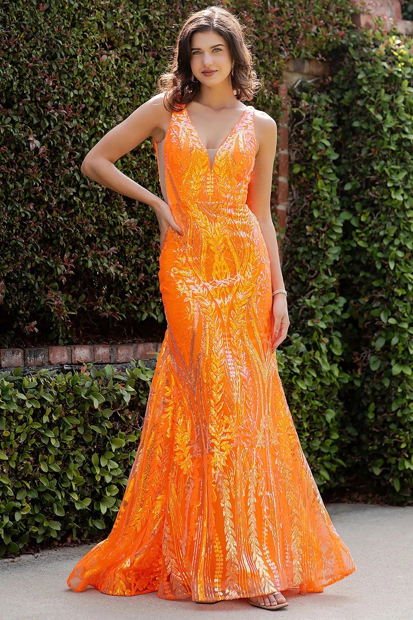 Orange prom dress with deep V-neckline and sheer mesh insert