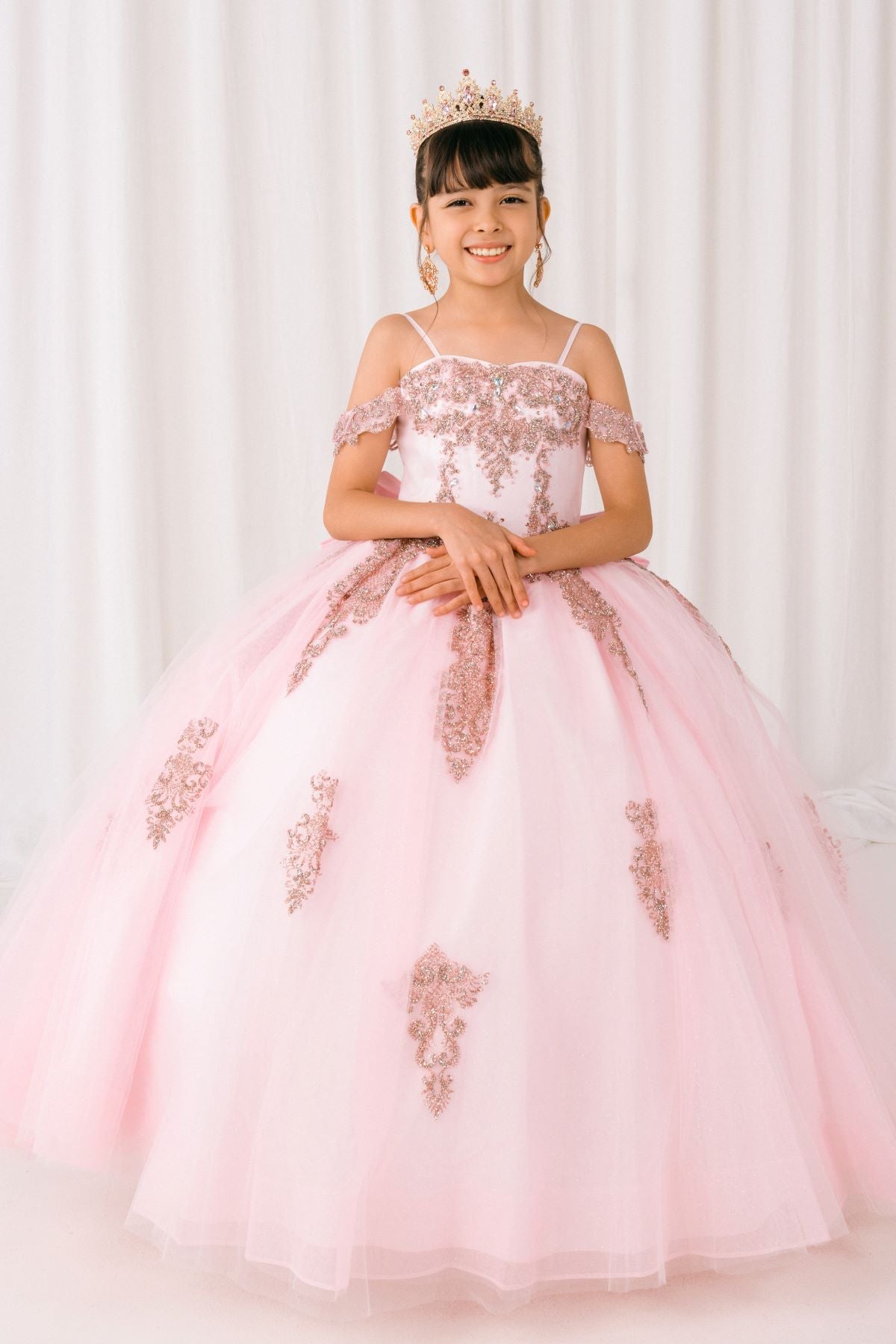 Pink front view kids mini quinceañera mini quince dress with sparkle bead details, layered tulle skirt.