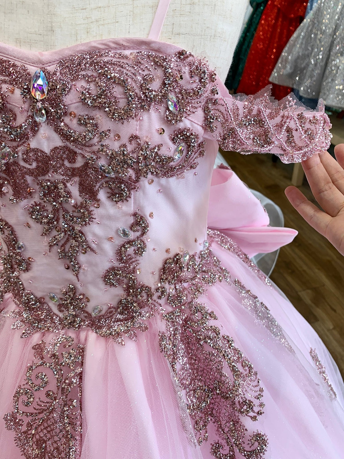 Pink front zoom kids mini quinceañera mini quince dress with sparkle bead details, rhinestones and layered tulle skirt.