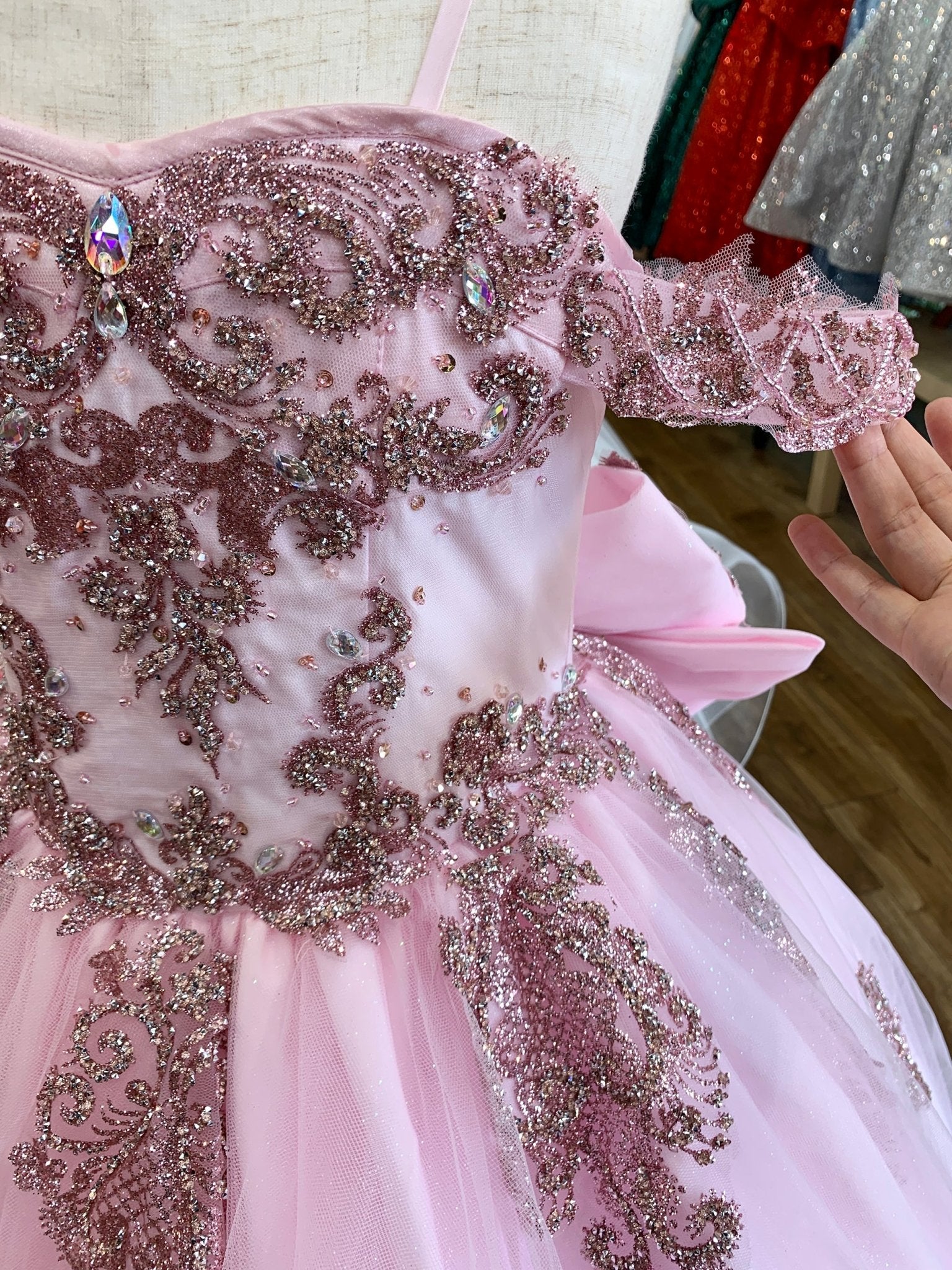 Pink front zoom kids mini quinceañera mini quince dress with sparkle bead details, rhinestones and layered tulle skirt.