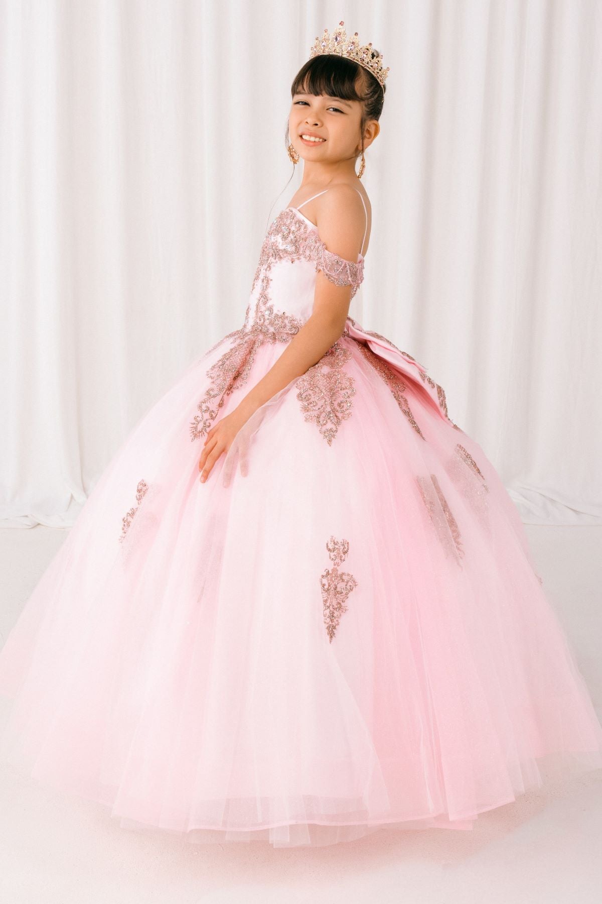 Pink front view kids mini quinceañera mini quince dress with sparkle bead details and layered tulle skirt.