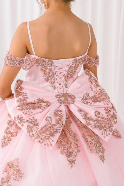 Pink evening gown with intricate gold embroidery on a white background