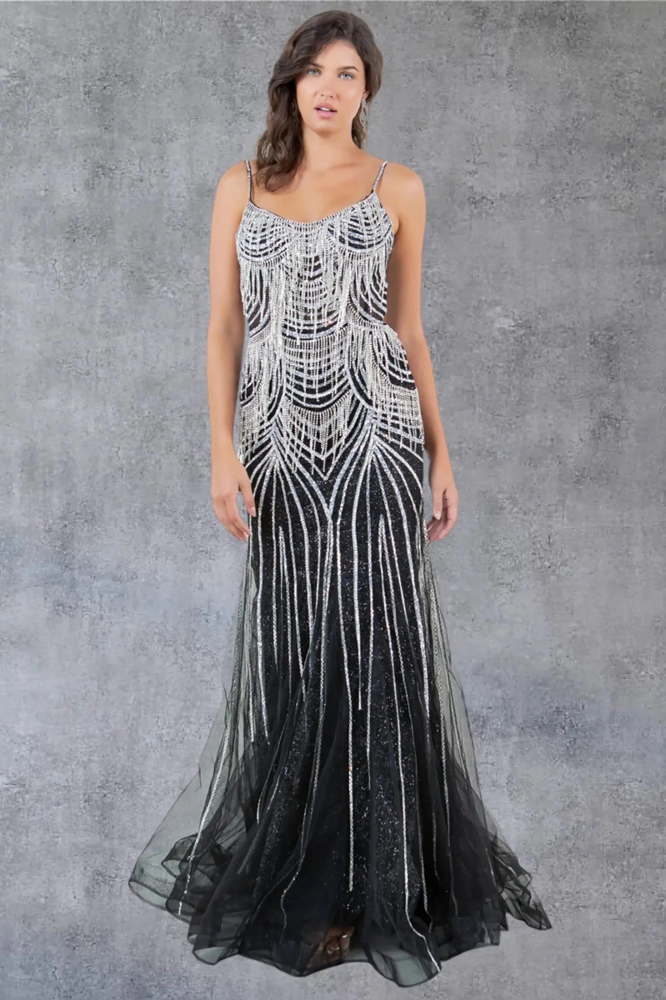 Full front view of a women wearing black beaded fringe prom dress with spaghetti straps and fitted silhouette.