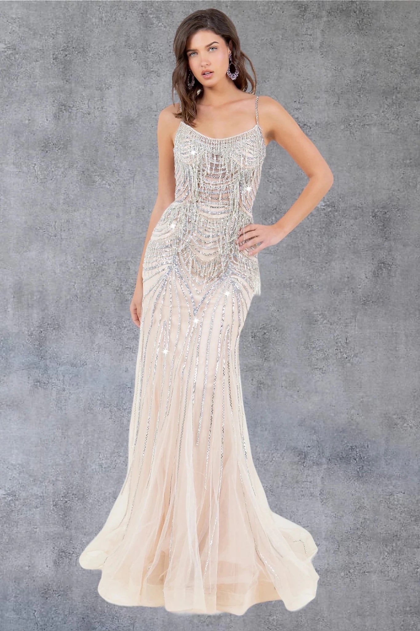 Nude evening gown with scoop neckline and spaghetti straps