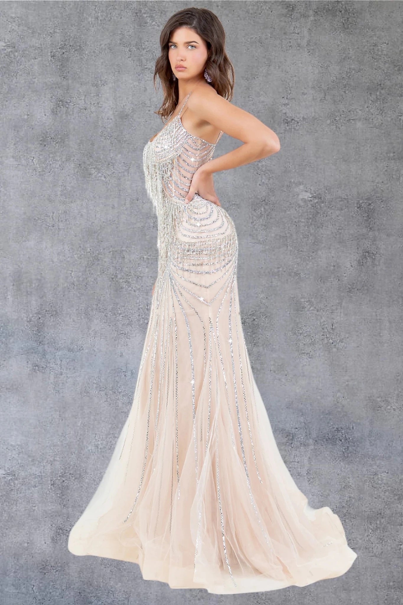 Nude evening gown styled with natural silhouette and long floor-length design
