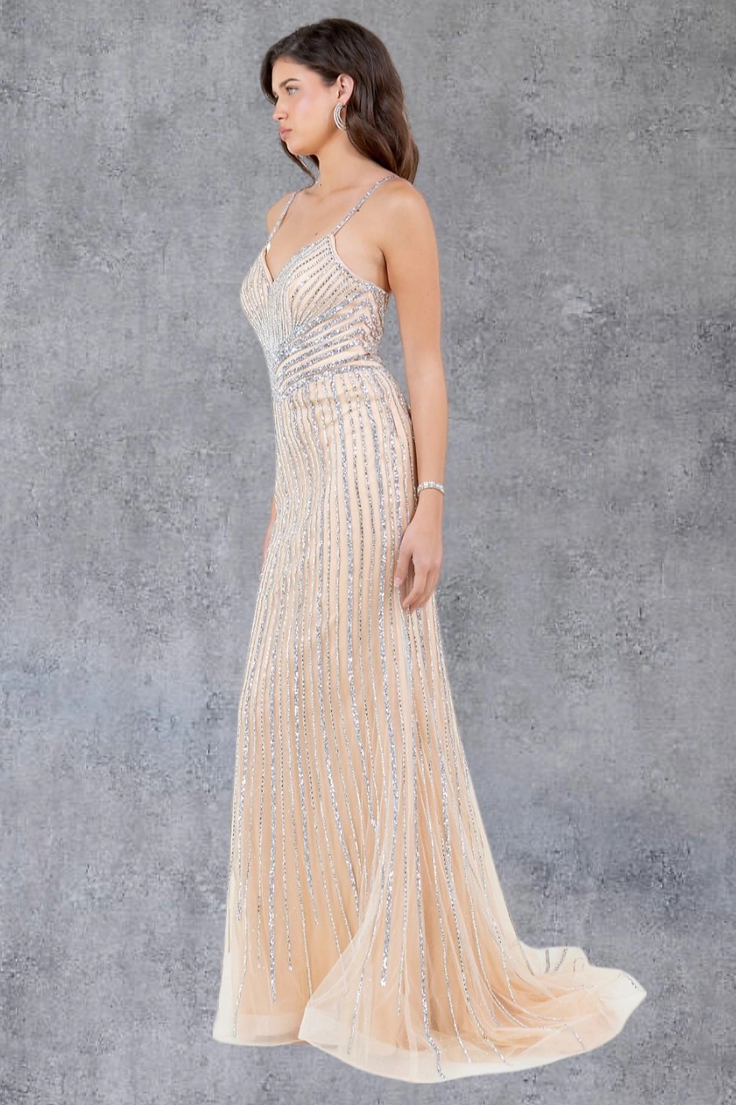 Nude evening dress showcasing fitted mermaid silhouette