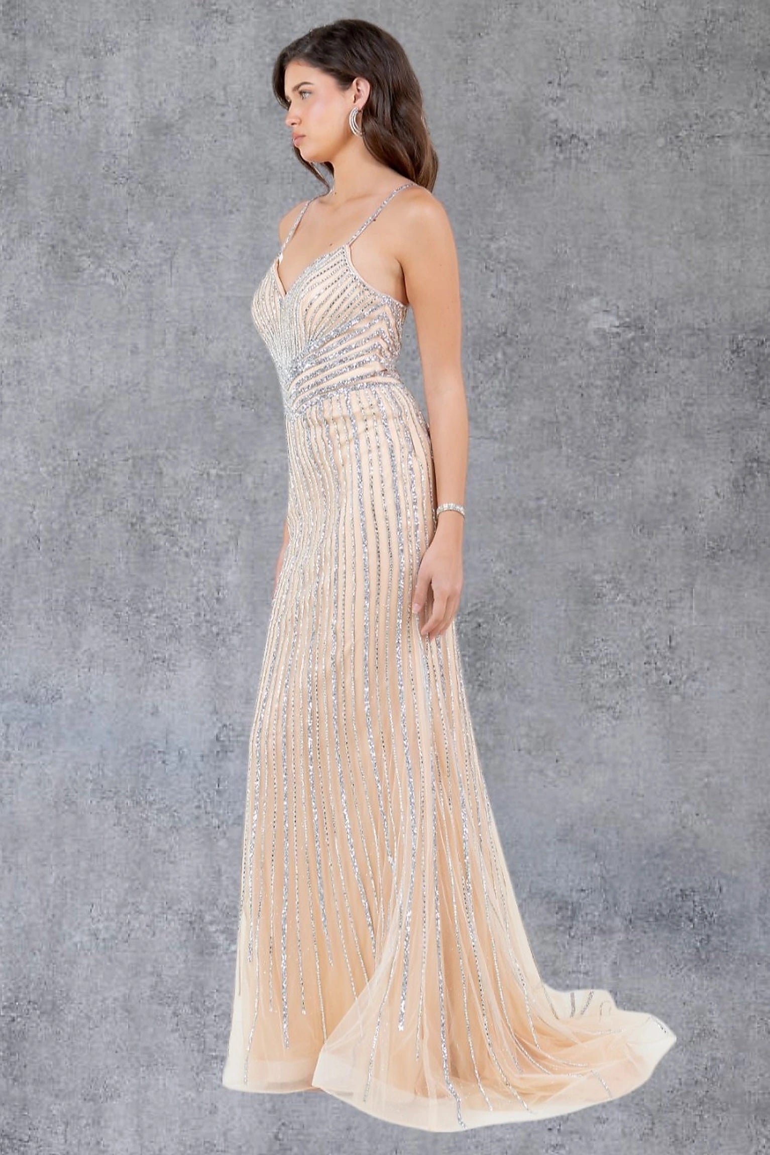 Nude evening dress showcasing fitted mermaid silhouette