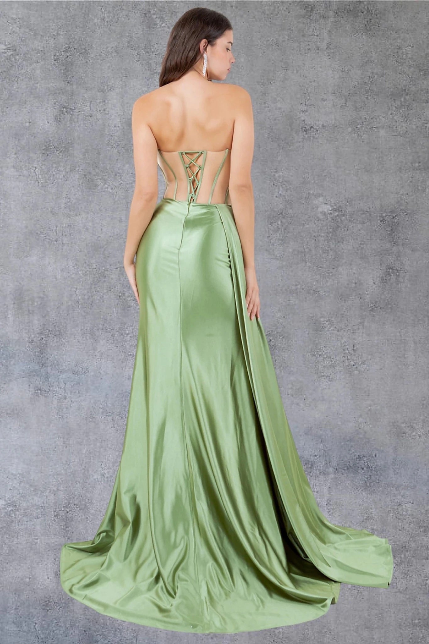 Sage prom dress styled with sheer cutout details creating corset appearance