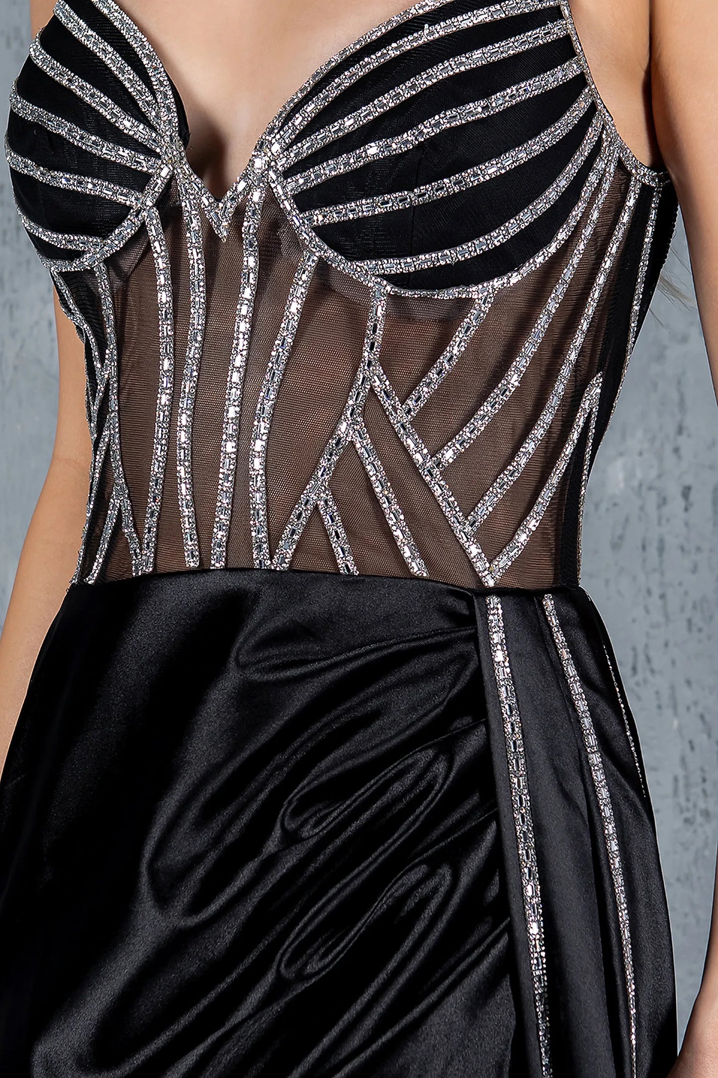 Black prom dress featuring rhinestone embellishments in geometric patterns