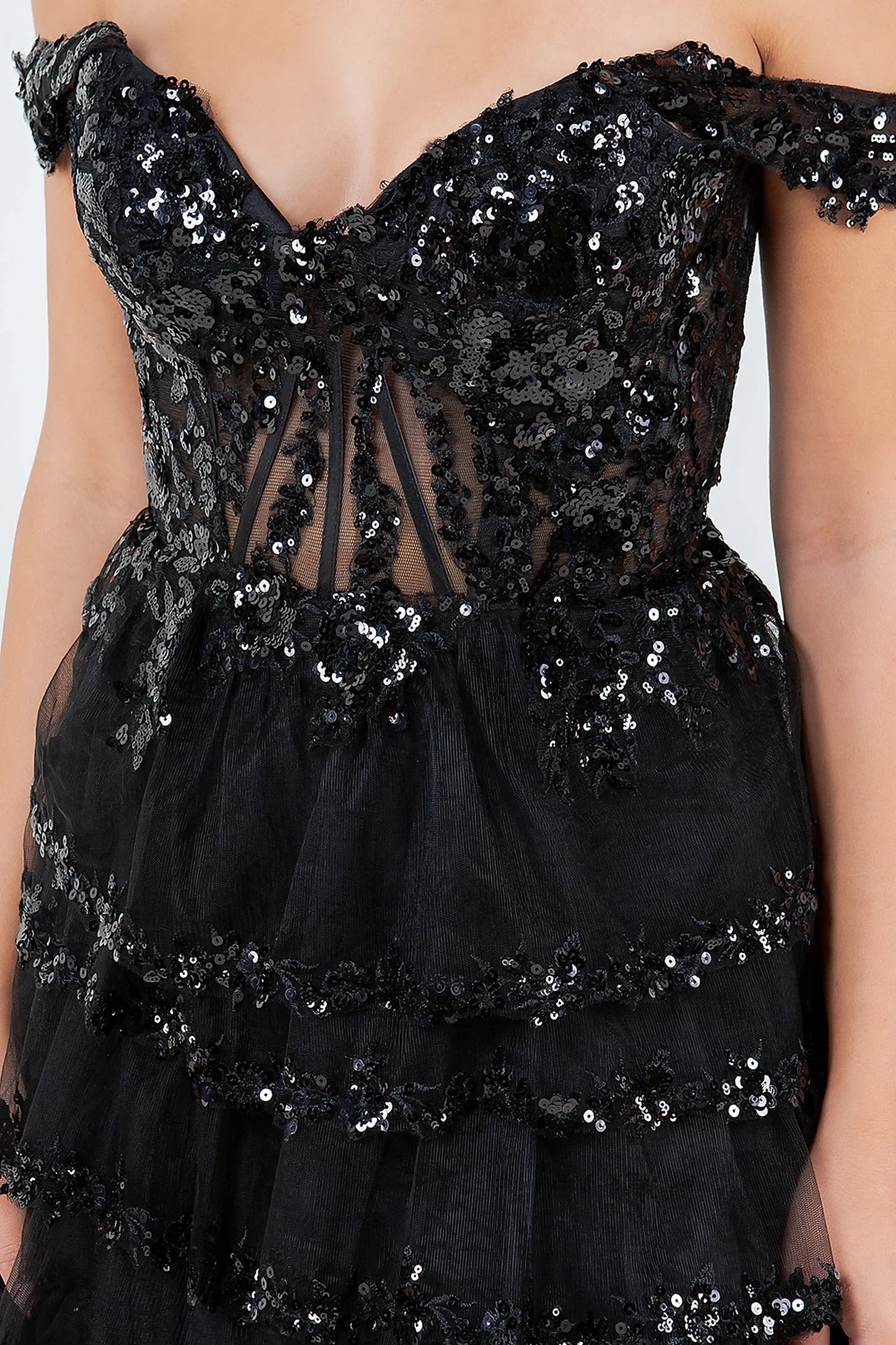 Black prom dress featuring corset bodice with beadwork and sequins