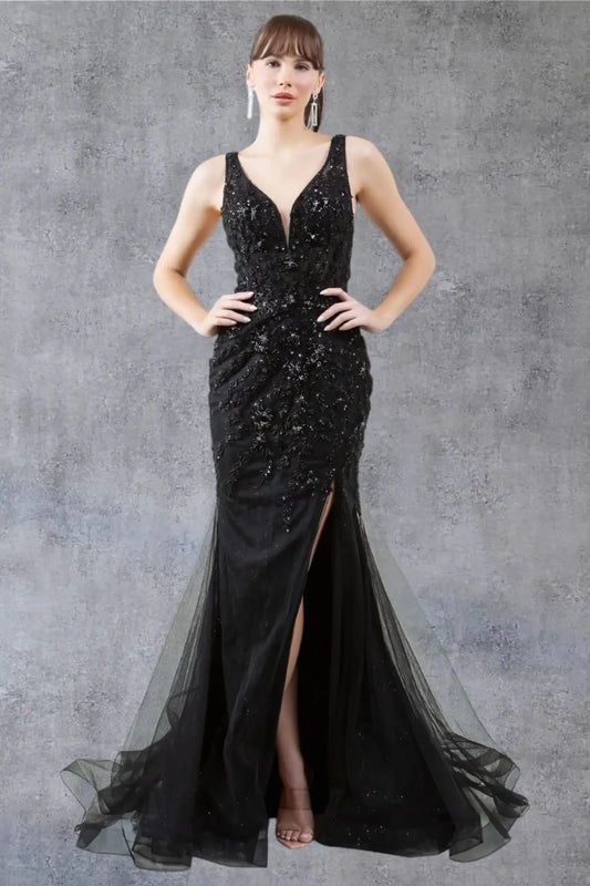 A full-length view of a woman wearing black lace formal prom dress with a scoop neckline detail.