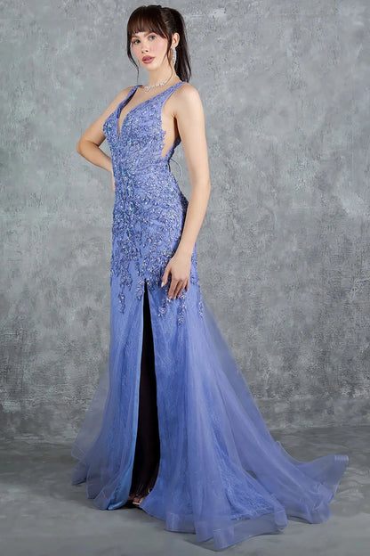 A side profile view of a woman wearing a blue prom dress, showcasing soft tulle movement and graceful flow.