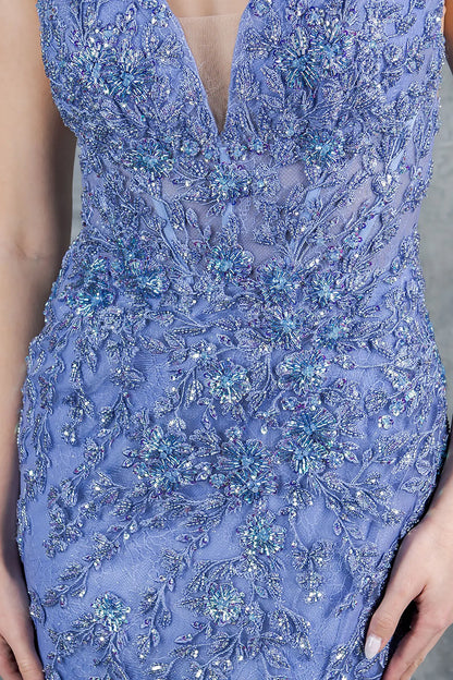 A close-up view of a woman wearing a blue lace bodice with sequin embellishment.