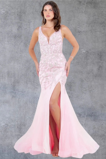 Full front view of a women wearing pink sleeveless prom dress with chantilly lace bodice and slit.