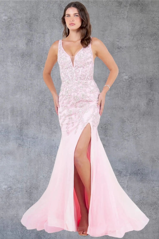 Full front view of a women wearing pink sleeveless prom dress with chantilly lace bodice and slit.