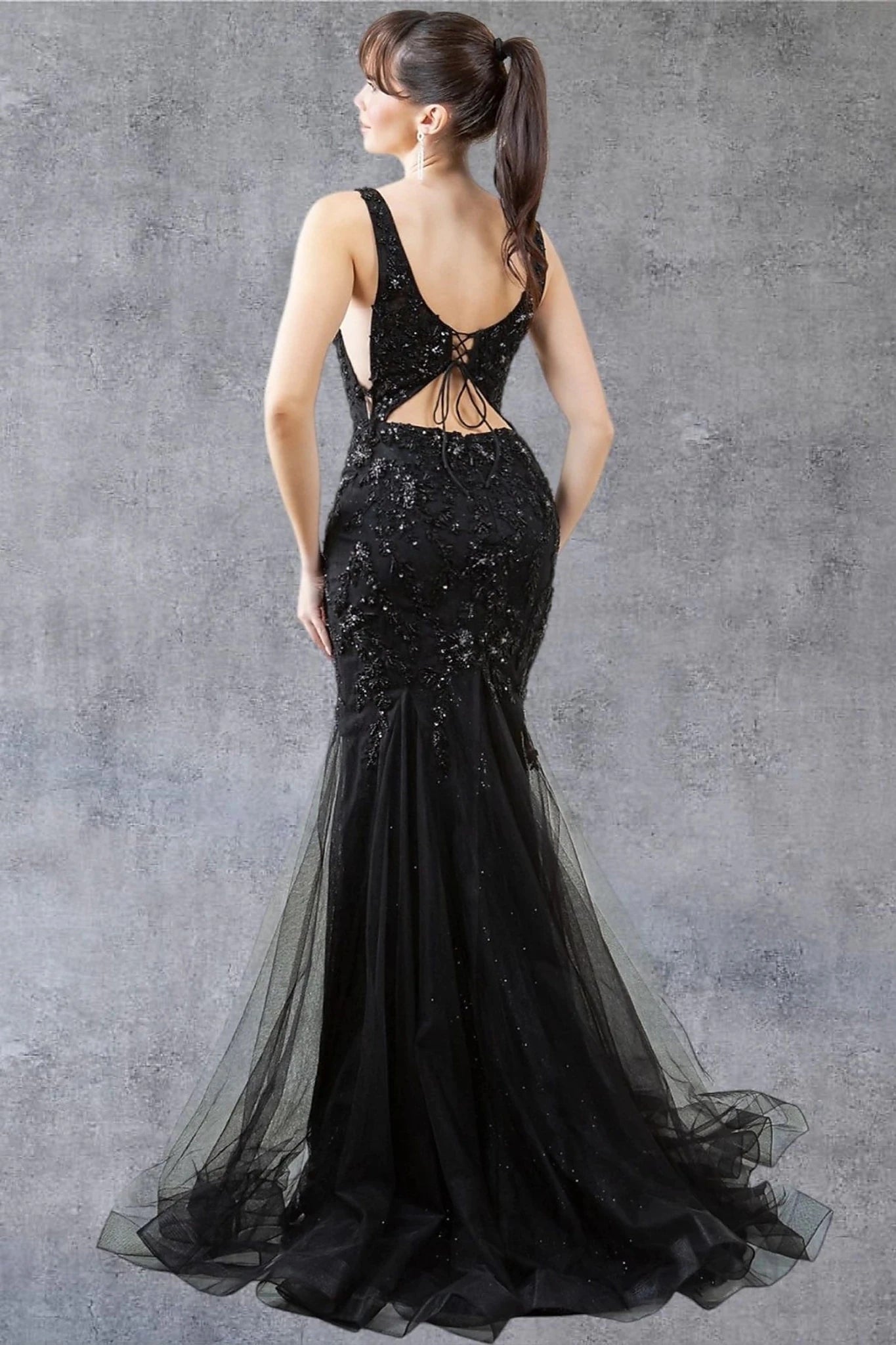 Black evening dress completed with deep scoop back lace-up and zipper closure