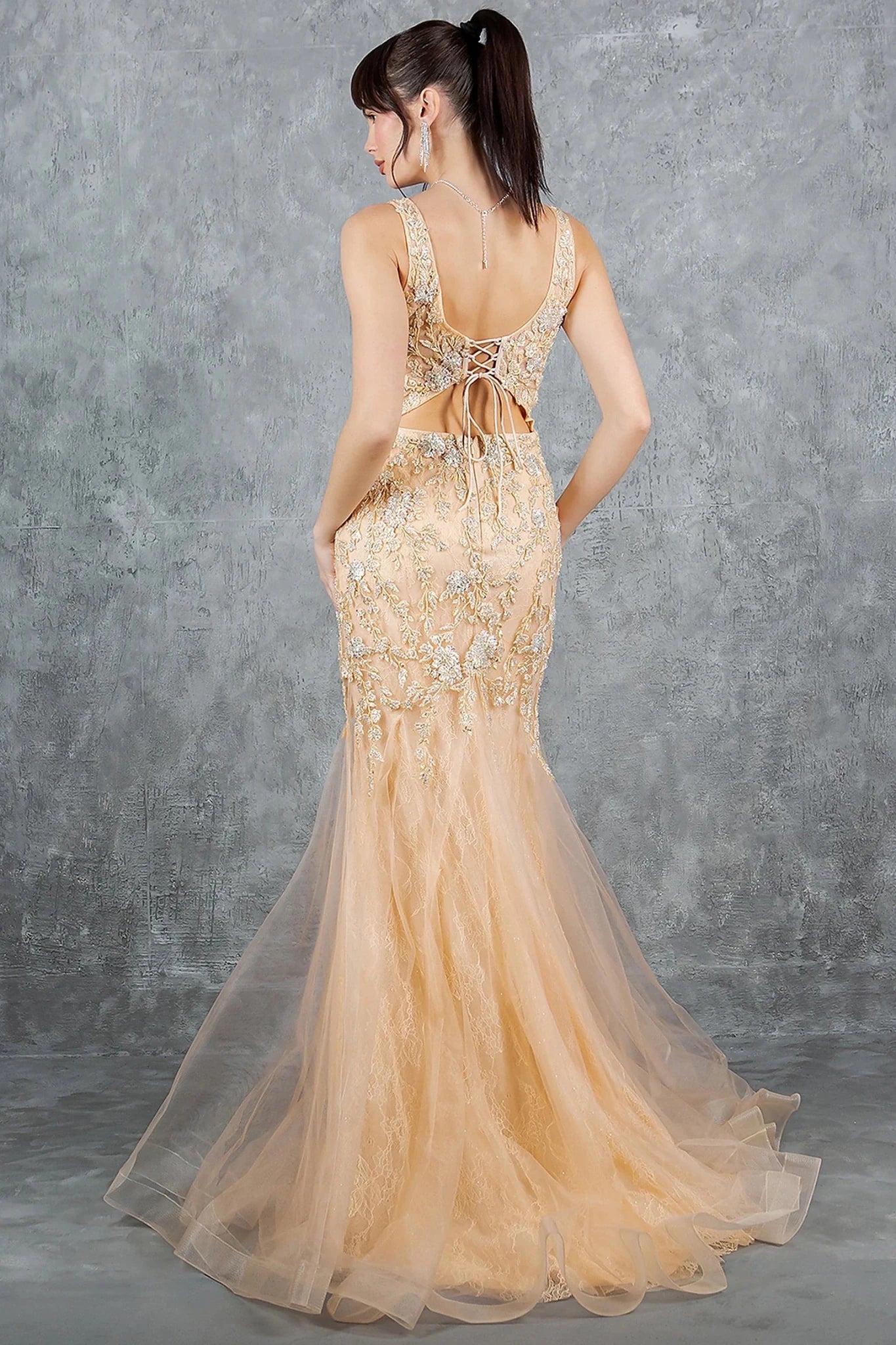 Champagne evening dress completed with deep scoop back lace-up and zipper closure