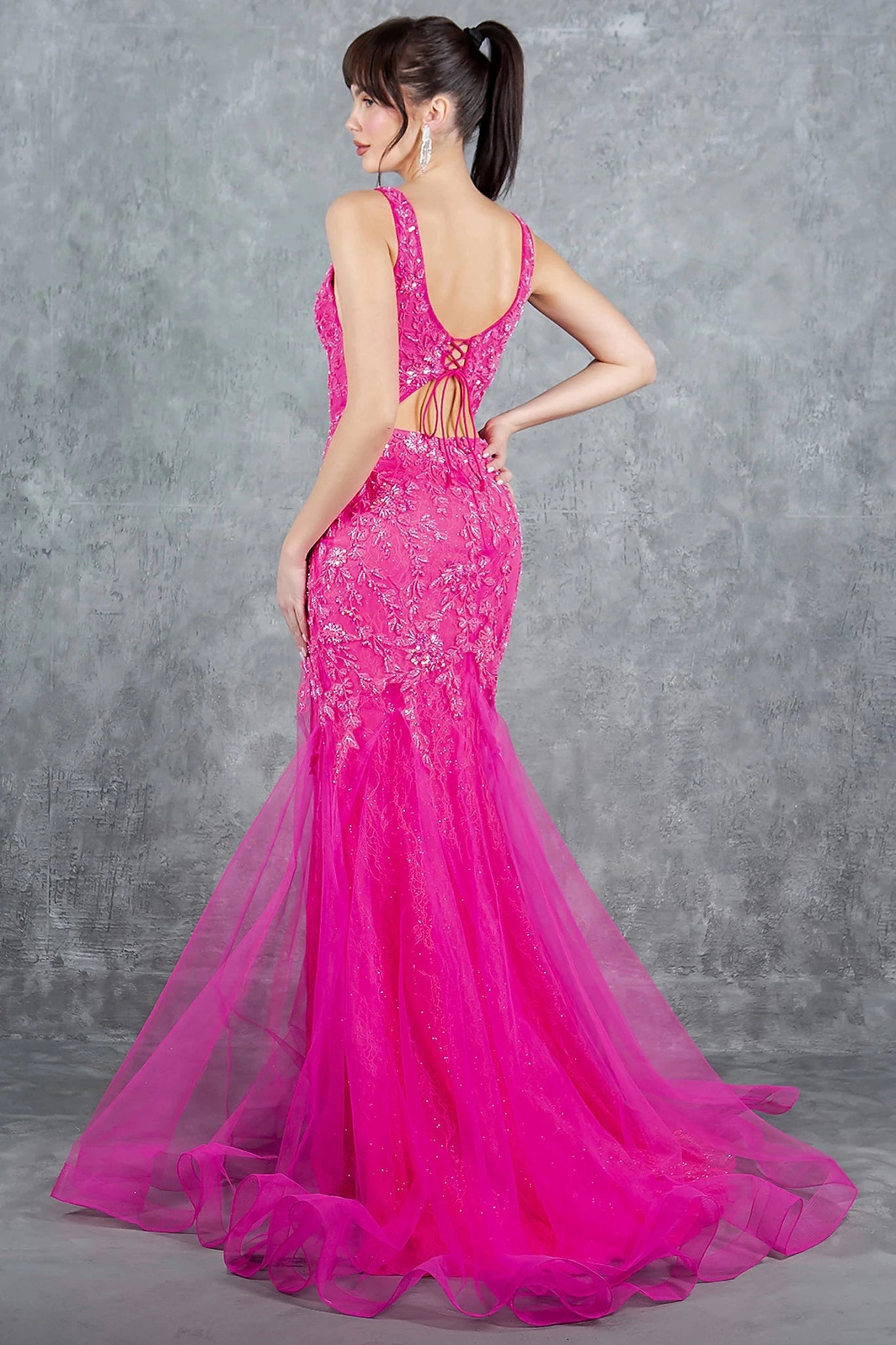 Fuchsia evening dress completed with deep scoop back lace-up and zipper closure