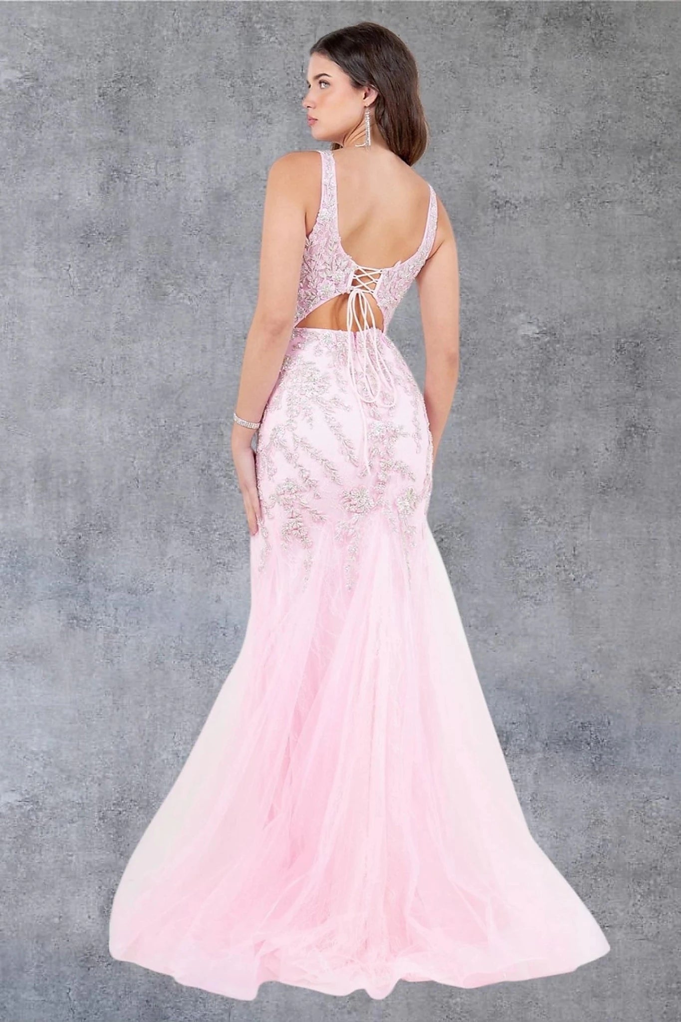 Pink evening dress completed with deep scoop back lace-up and zipper closure
