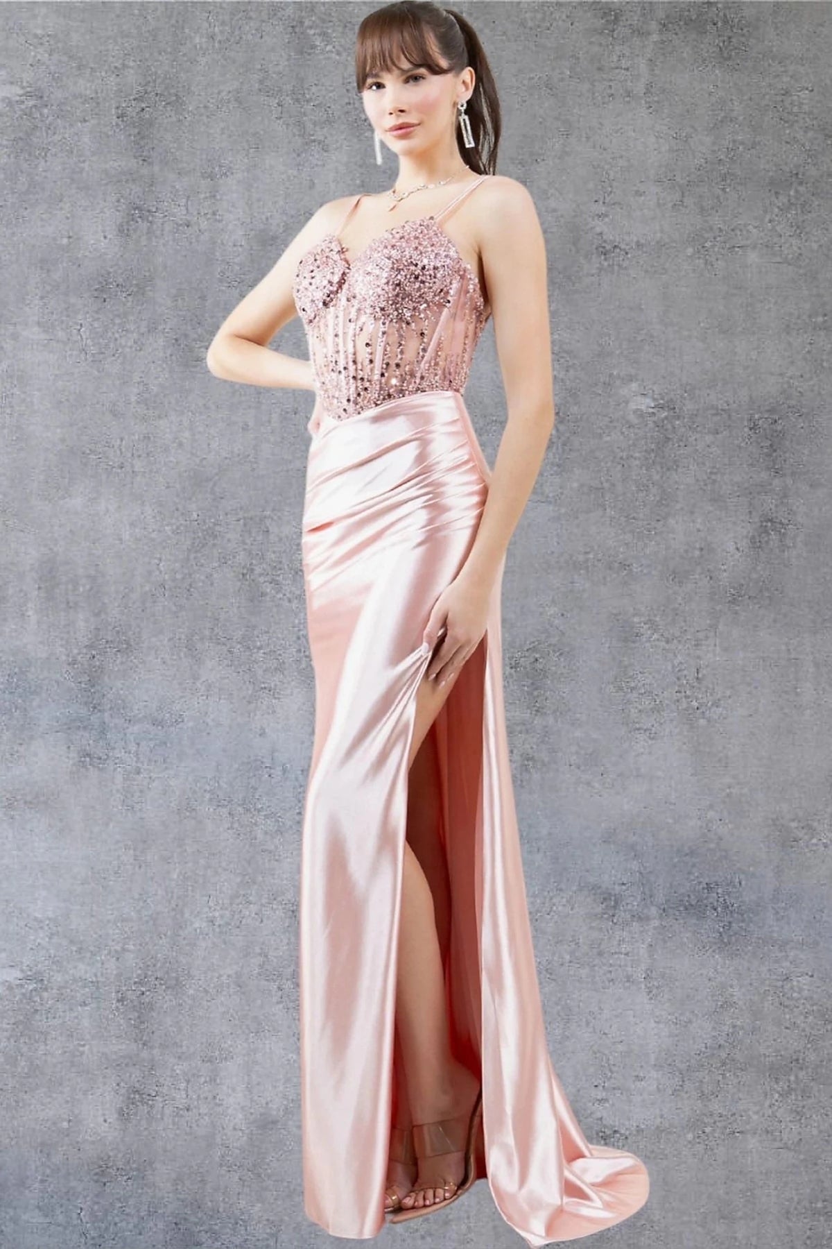 Detailed view highlights rose Gold prom dress completed with thigh-high slit for movement.