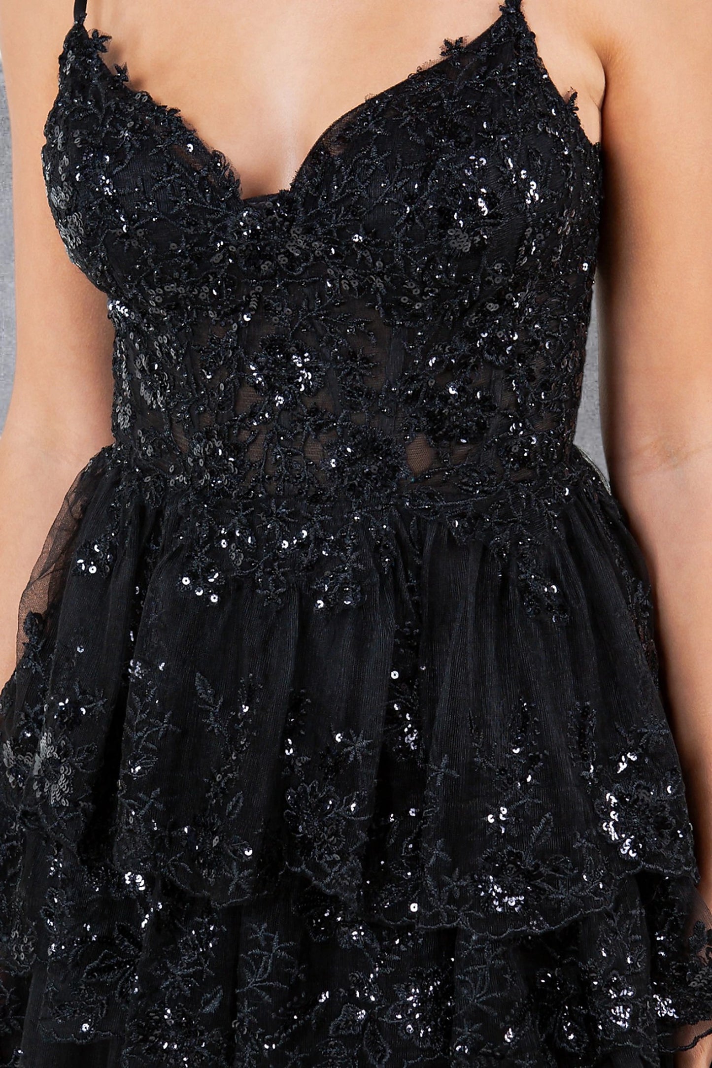 Black prom dress featuring fitted corset bodice with beadwork