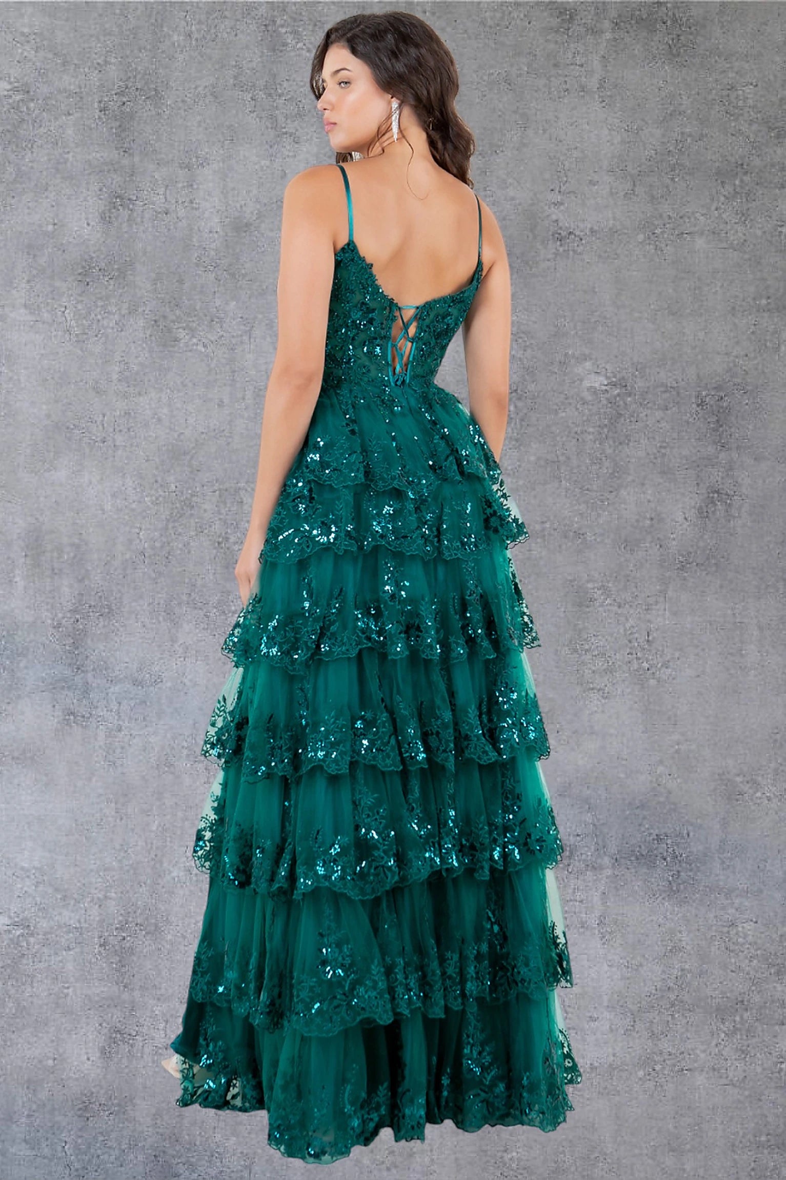 Green prom dress designed with corset lace-up back and zipper closure