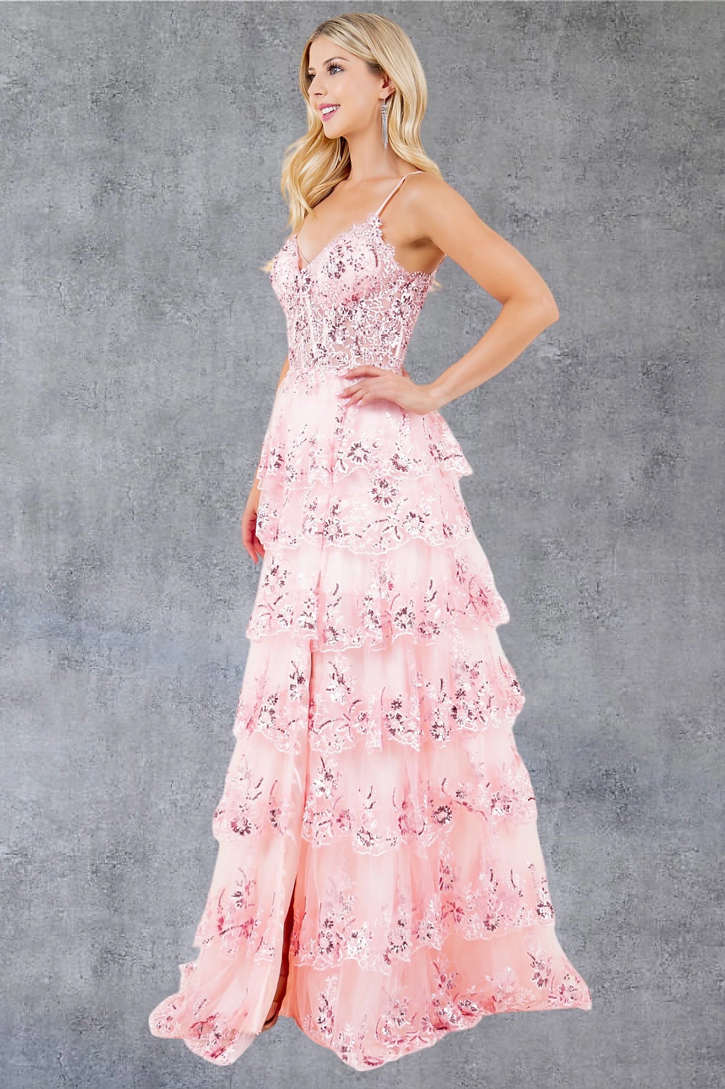 Pink prom dress completed with thigh-high slit for movement