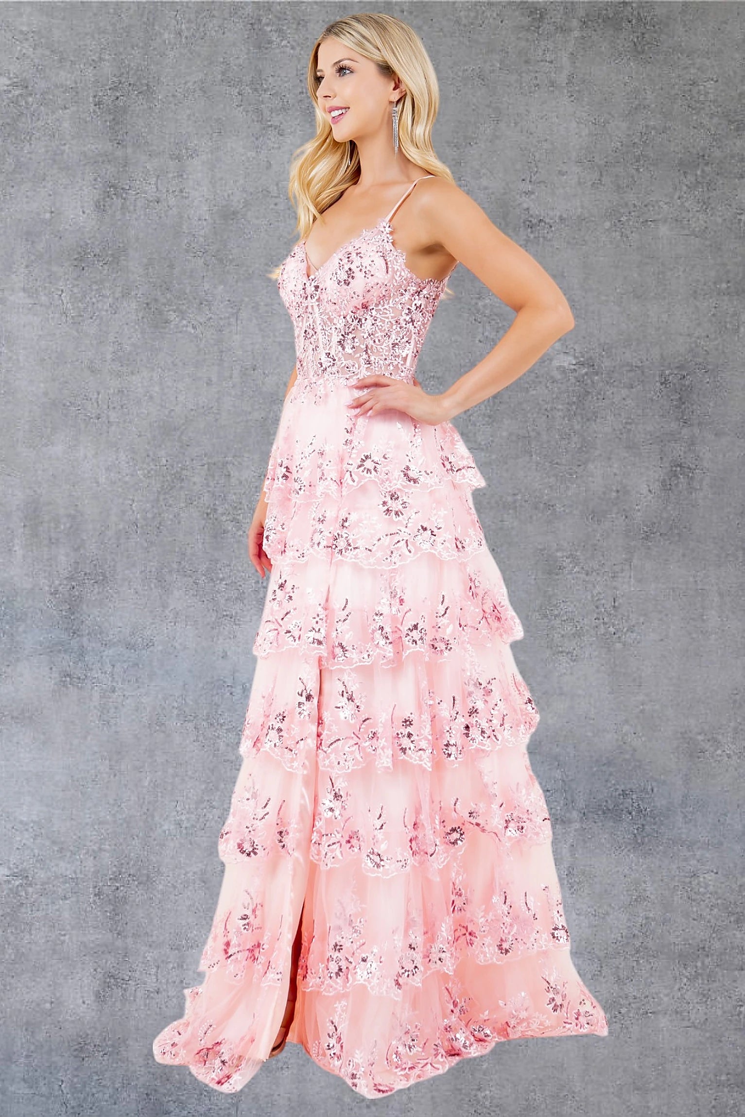 Pink prom dress completed with thigh-high slit for movement