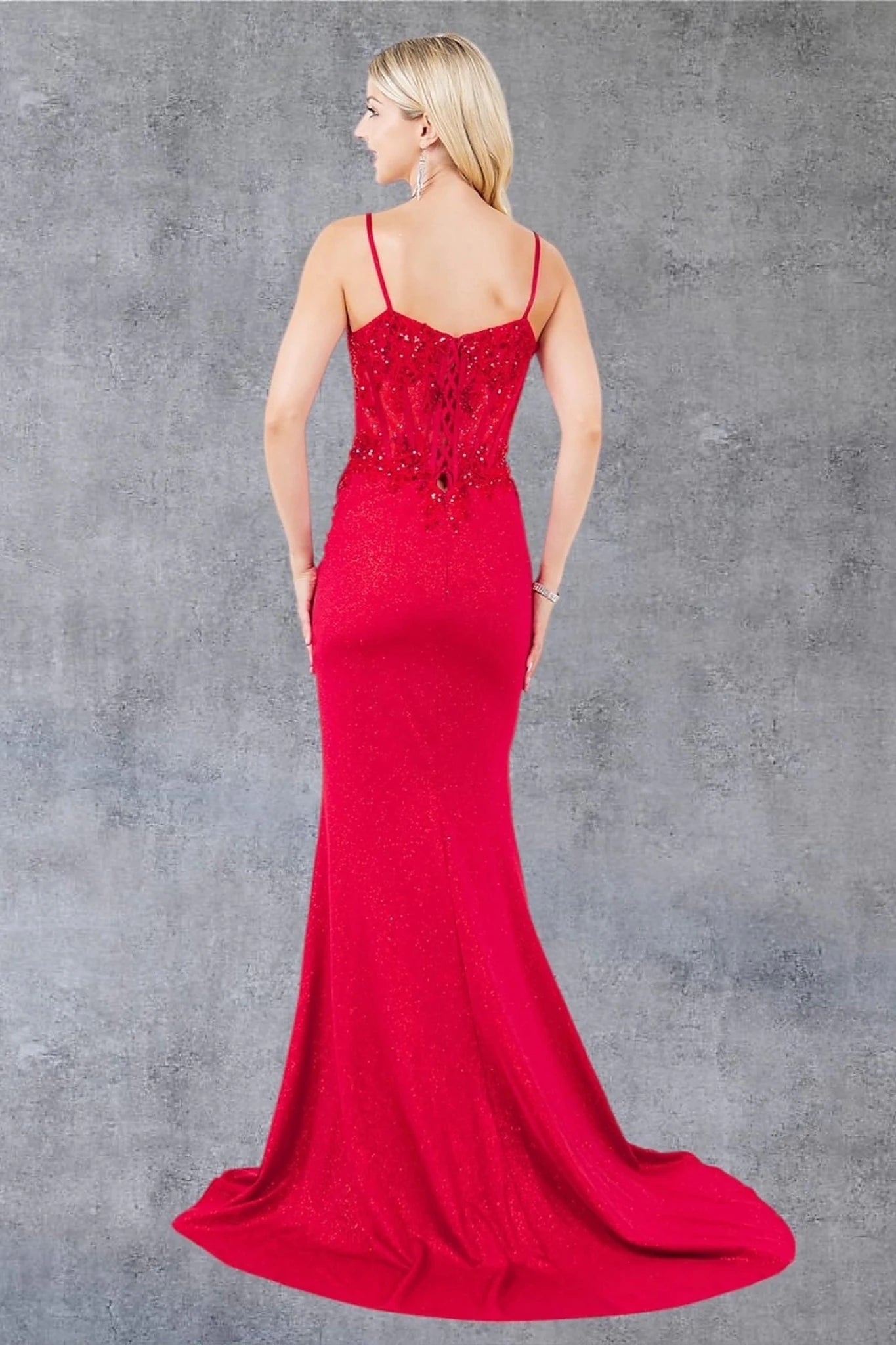Red prom dress designed with floor-length silhouette and subtle train