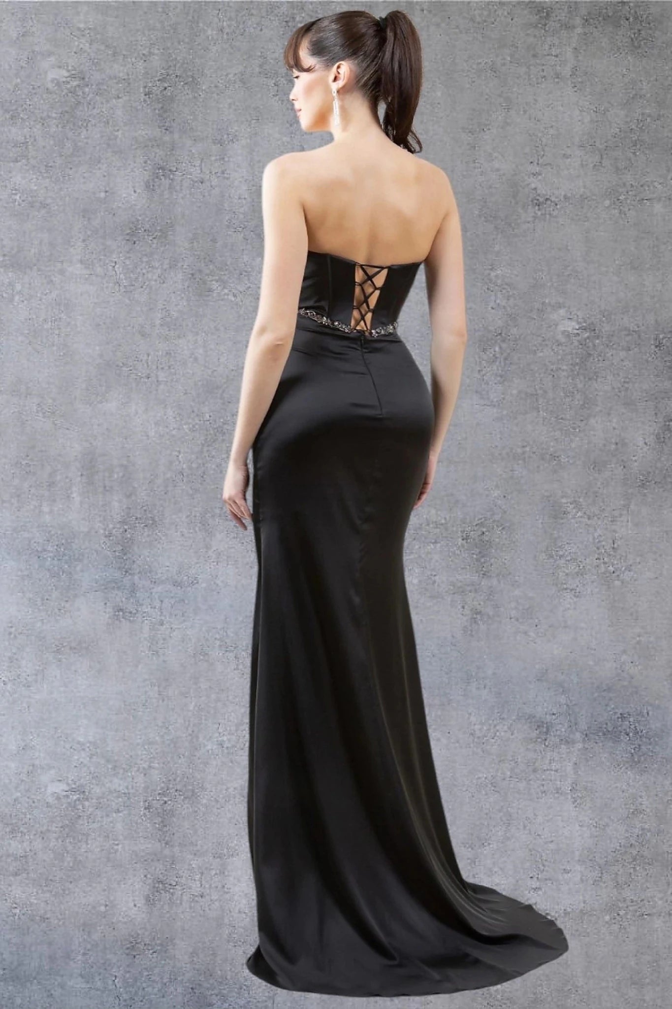 Black gown designed with floor-length silhouette and lace back up